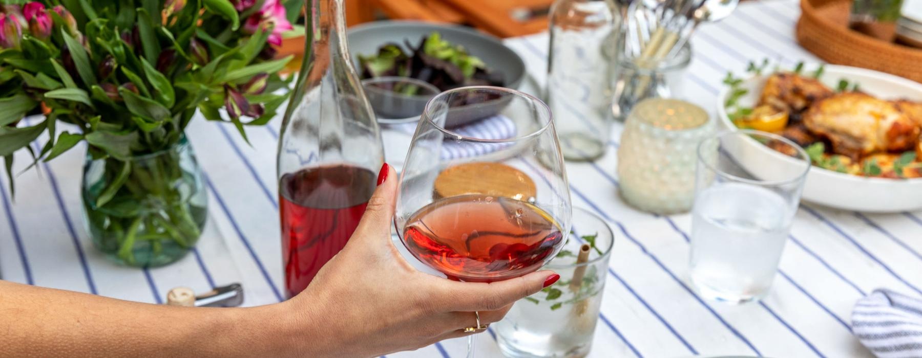 a person holding a glass of wine